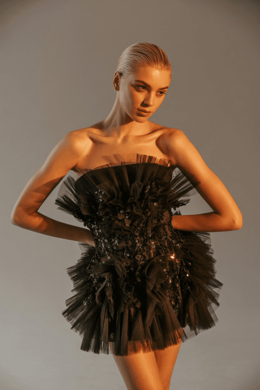 Strapless Black Mini Dress With Tulle Ruffles And Sequin Embellishments, Creating A Voluminous Look